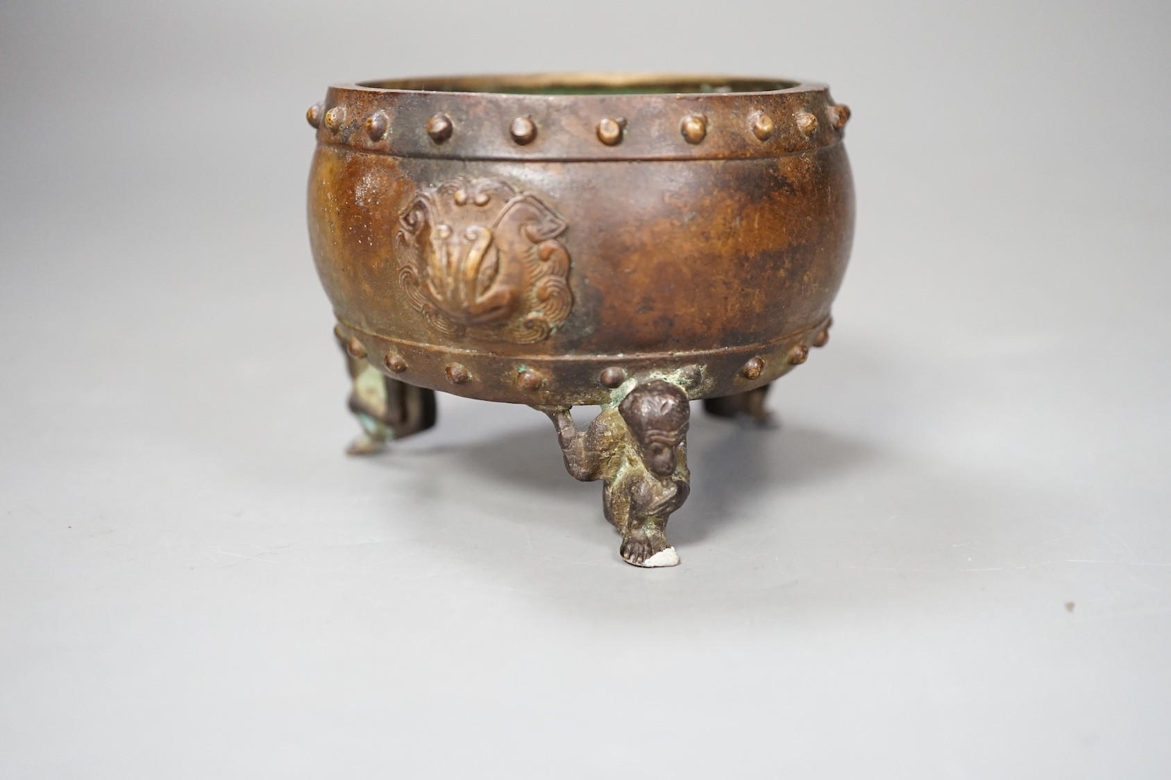 A Chinese bronze tripod censer, Xuande mark - 7cm tall